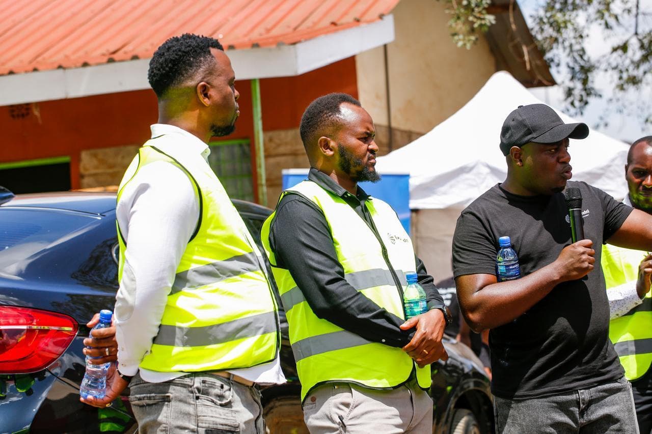 Expendo team members in reflective vests at an event