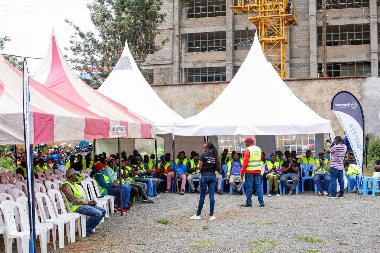 Riders seated under tents at an Expendo community event